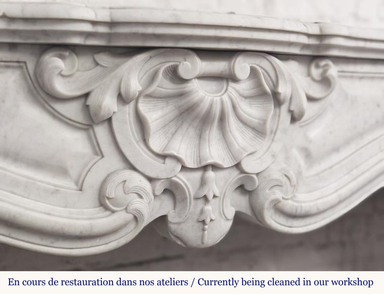 Large Louis XV style fireplace in Carrara marble decorated with shells and flowers Large Louis XV style fireplace in Carrara marble decorated with shells and flowers-1