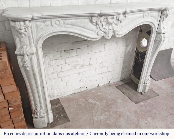 Large Louis XV style fireplace in Carrara marble decorated with shells and flowers Large Louis XV style fireplace in Carrara marble decorated with shells and flowers-2