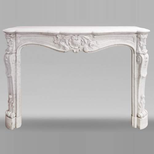 Louis XV style fireplace in Carrara marble, with shell and flower decoration