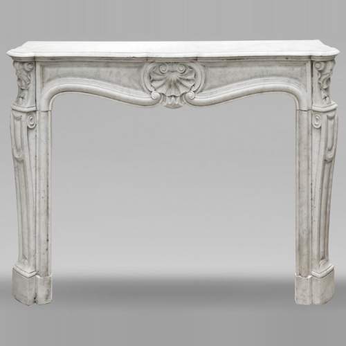 Louis XV style fireplace in Carrara marble decorated with a shell