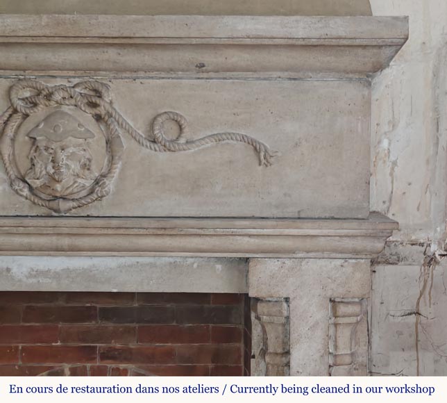 Carved stone fireplace with three-faced mask decoration-6