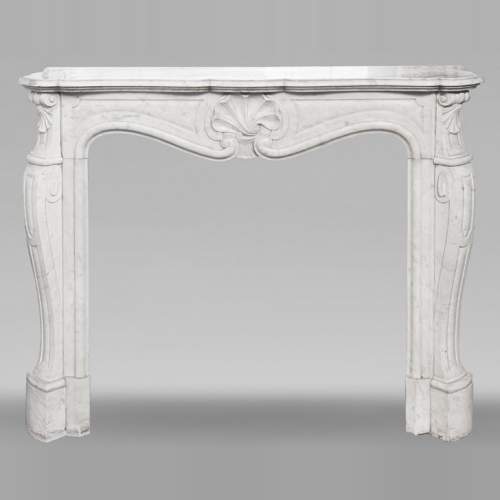 Louis XV style fireplace in Carrara marble, with a spiral shell