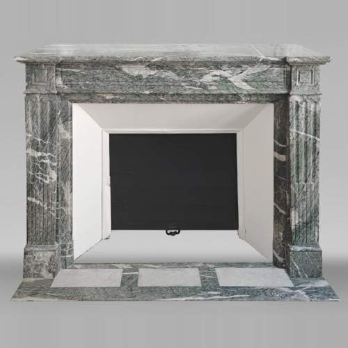 Louis XVI style molded fireplace in green Campan marble