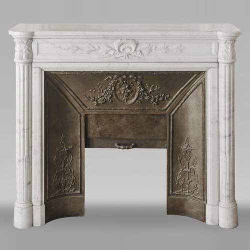 Louis XVI style fireplace with a Corinthian fluted half-column, in half-statuary marble