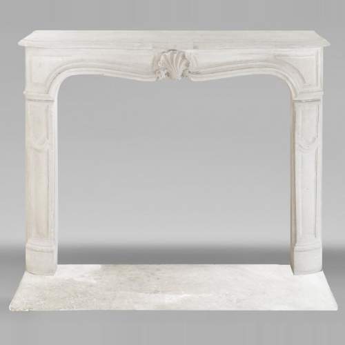 Louis XV style stone fireplace, decorated with a shell