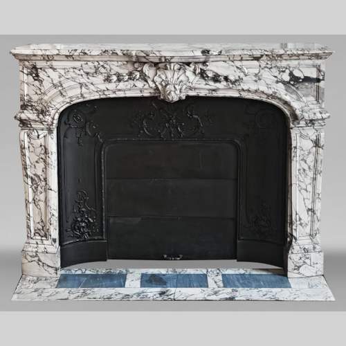 Important Regency-style fireplace adorned with a shell motif, in purple breccia marble