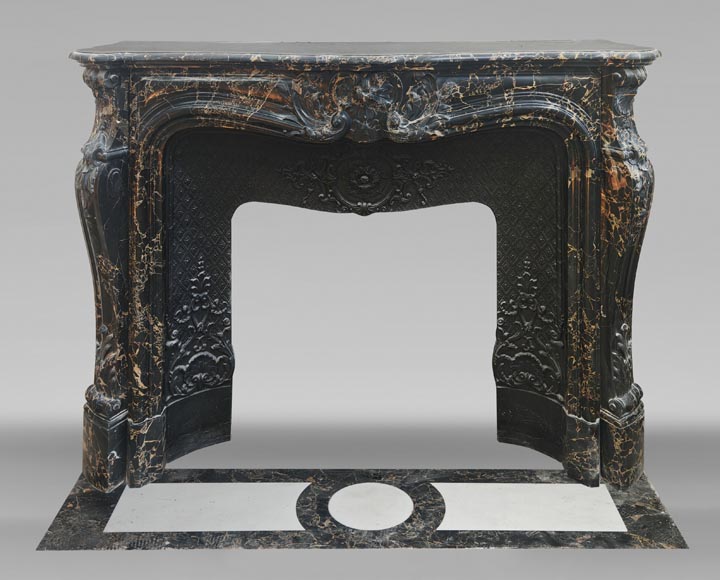 Louis XV style fireplace in richly sculpted Portoro marble Louis XV style fireplace in richly sculpted Portoro marble-0