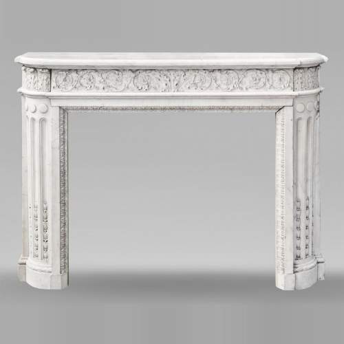 Finely carved Louis XVI style fireplace in statuary marble
