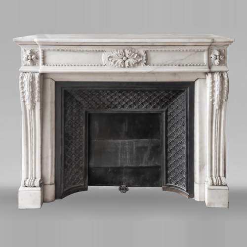 Louis XVI-style statuary marble fireplace featuring acanthus leaf and bead-and-reel motifs