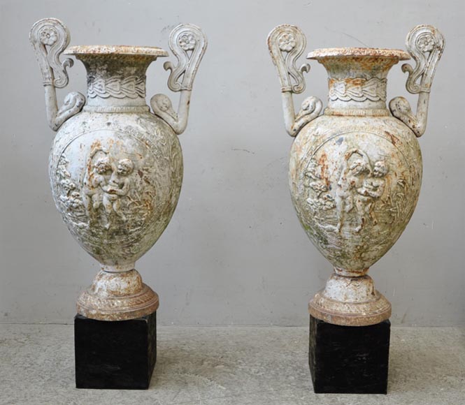 Antique pair of cast iron vases with putti Antique pair of cast iron vases with putti-0